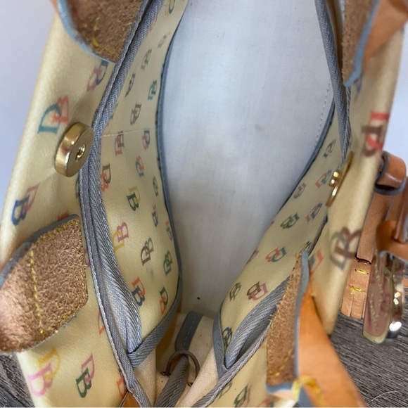 Dooney & Bourke Cream Satchel Bag pre-owned. Strap has stain. - Picture 10 of 16